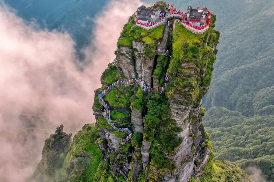 UNESCO World Heritage mountain with soaring golden summit, sea of clouds and ancient Buddhist temples