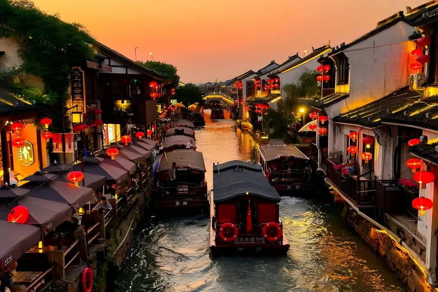 Shantang Street in Suzhou presenting riverside ancient buildings with white walls and black tiles along Shantang River