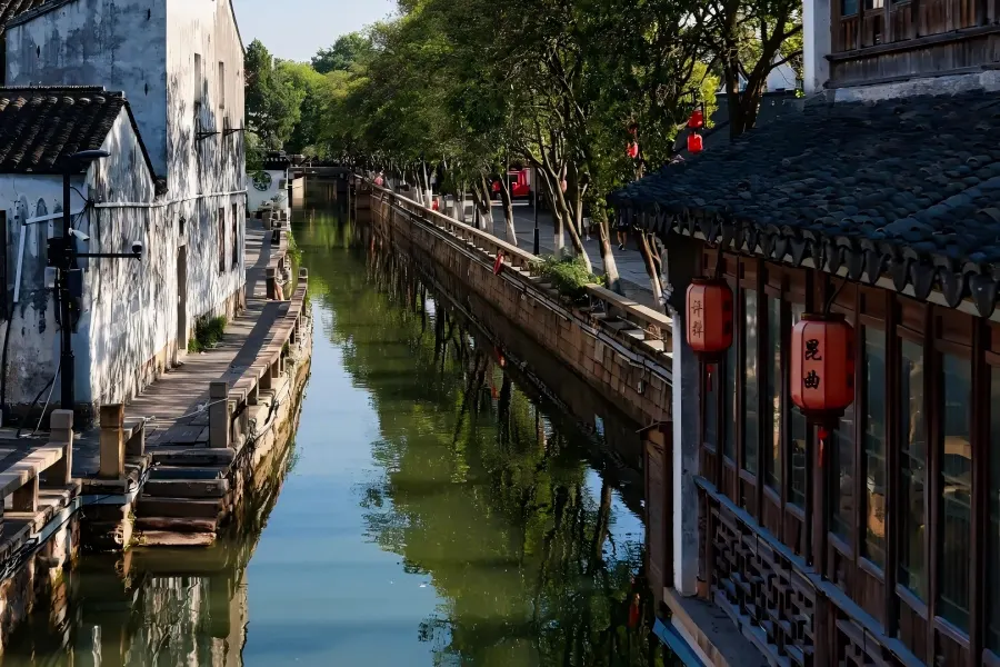 Pingjiang Road in Suzhou showing ancient street scenery with old buildings and water canals