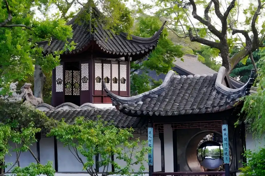 Zhuozheng Garden in Suzhou showing elegant classical Chinese gardens with pavilions, ponds and rockeries