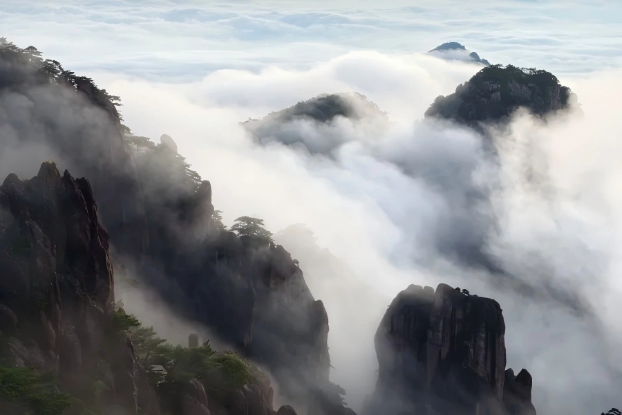 Sea of Clouds in Huangshan showing vast misty clouds surrounding jagged mountain peaks