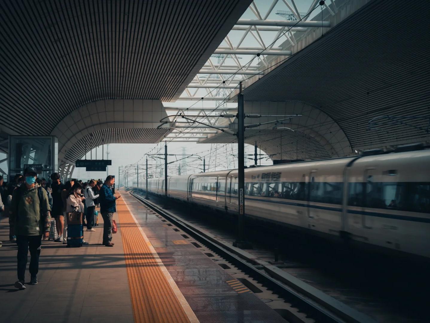 Passengers Waiting for High?Speed Train on Modern Railway Station Platform