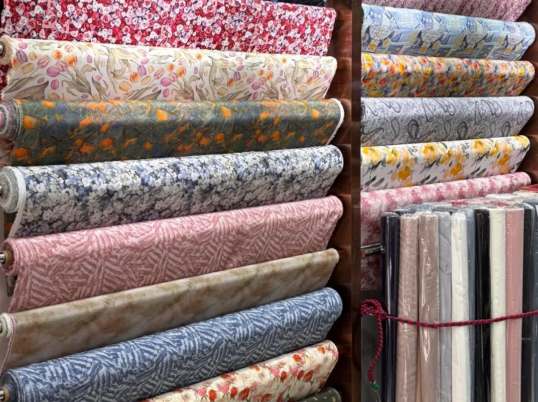 Assorted colorful printed silk fabric rolls in Hangzhou silk shop