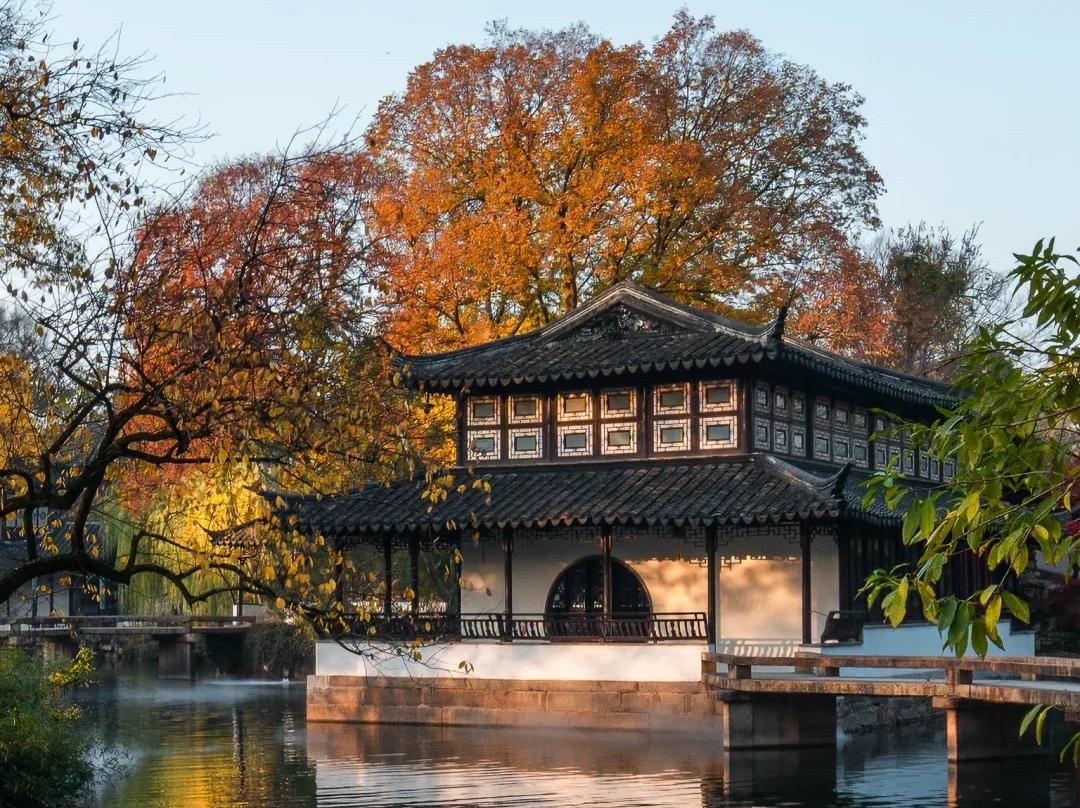Fall scenery of waterside ancient building in Suzhou classical garden