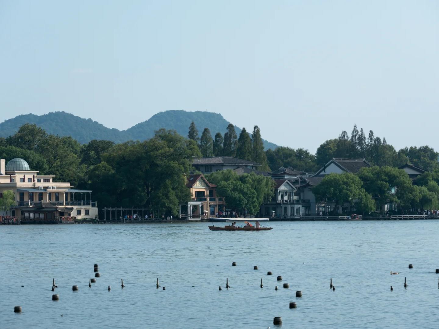 West Lake scenery with boat and shore residences