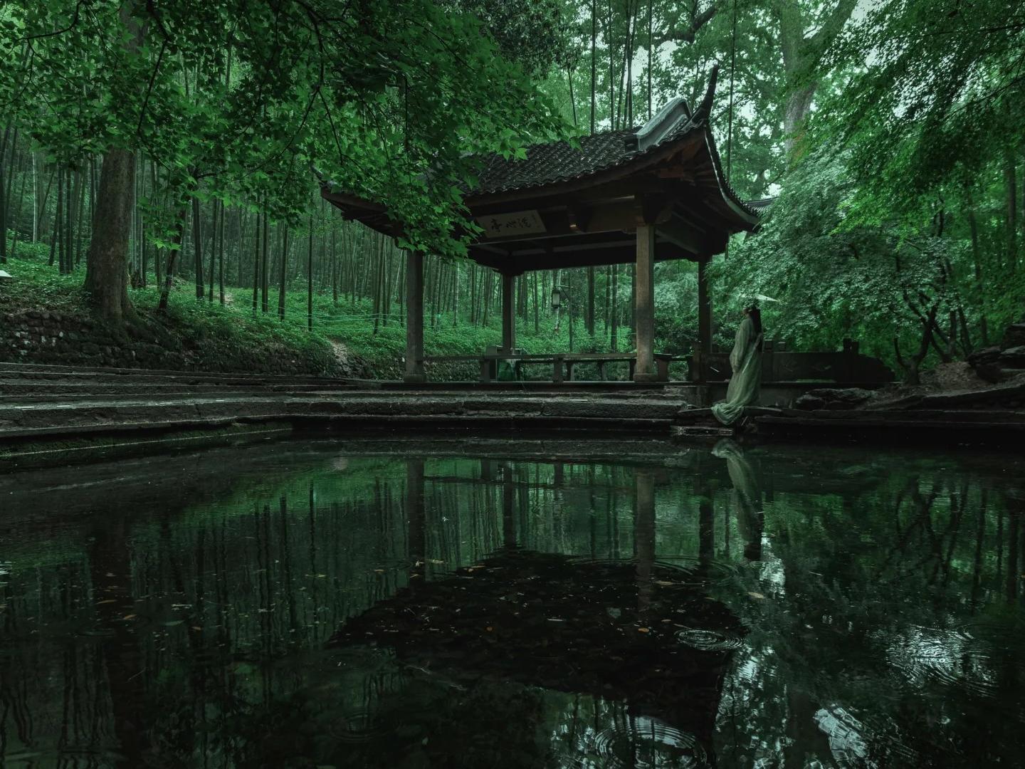 Historic pavilion and pond in Yunqi bamboo grove
