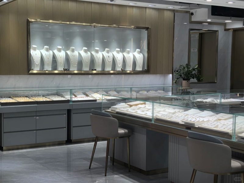 Jewelry showroom with display cabinets and necklaces on mannequins