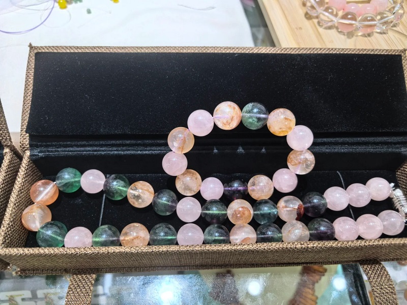 Rose quartz and fluorite stone bracelets in box