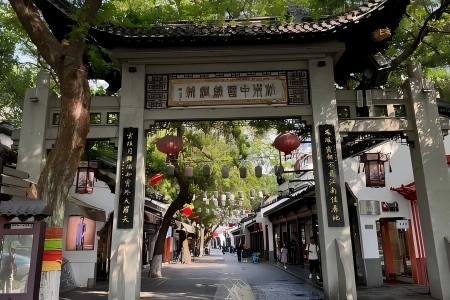 Archway of Hangzhou China Silk City Stone arch gate of China Silk City Hangzhou, ancient Jiangnan street decorated with red lanterns