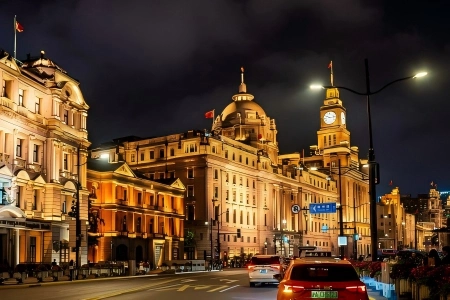 The Bund Historic Buildings at Night Shanghai Illuminated European-style heritage buildings along The Bund at night, traffic on the city road