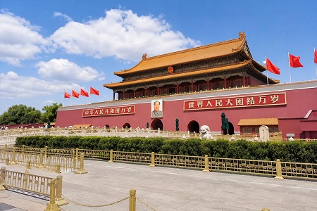 Tiananmen Gate in Beijing, China under a bright blue sky during the day