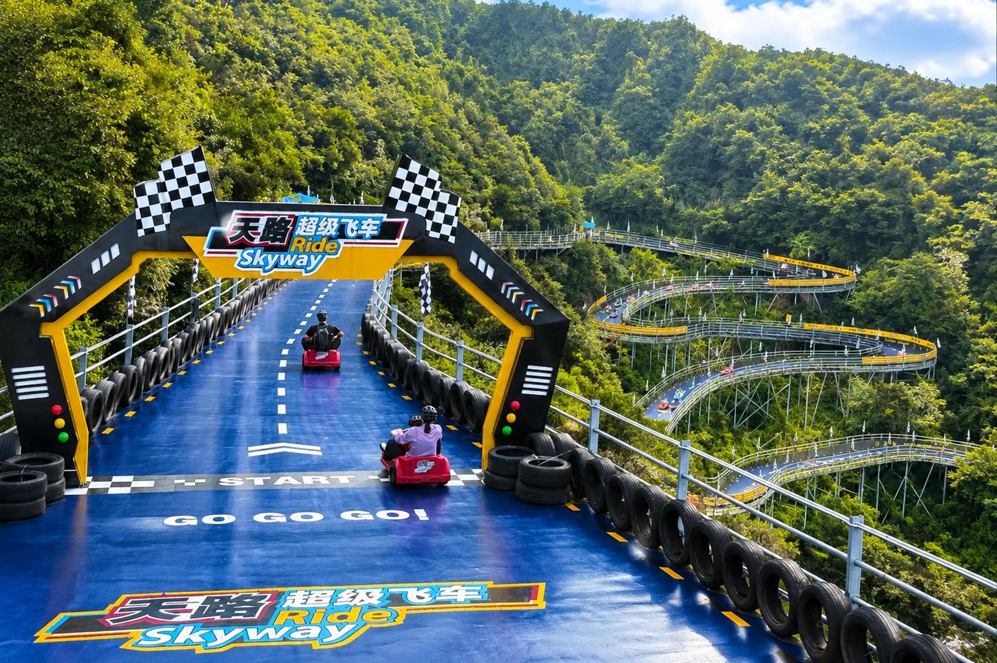 Spiral mountain slide at Hangzhou OMG Heartbeat Paradise surrounded by lush forest scenery