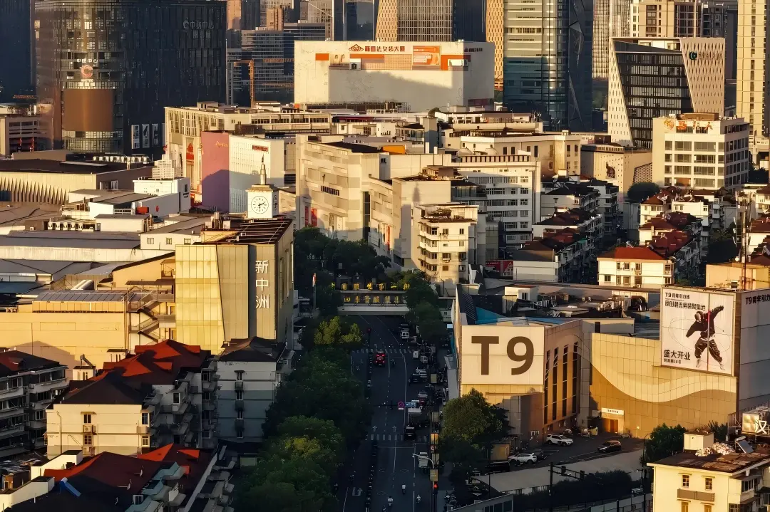 Aerial cityscape of Hangzhou Sijiqing garment wholesale district, T9 and Xinzhongzhou buildings at golden hour
