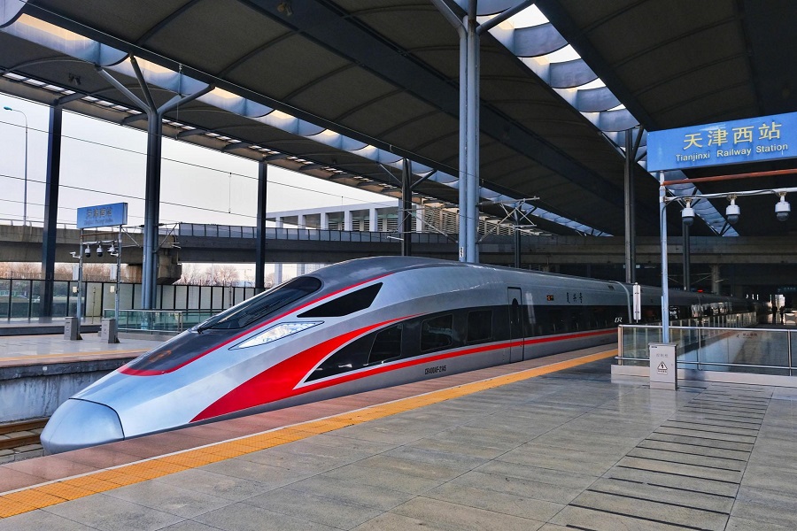 Fuxing bullet train stopped at platform of Tianjinxi Railway Station, modern high?speed railway station canopy