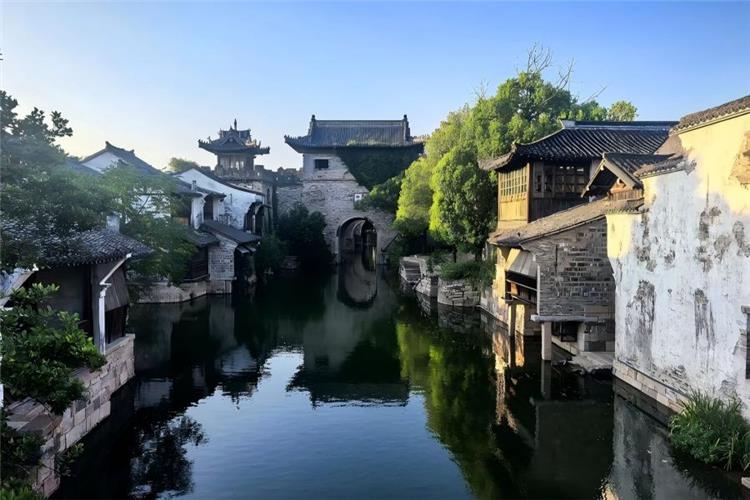 Yanguan Ancient Town in Hangzhou showing ancient street buildings and riverside scenery