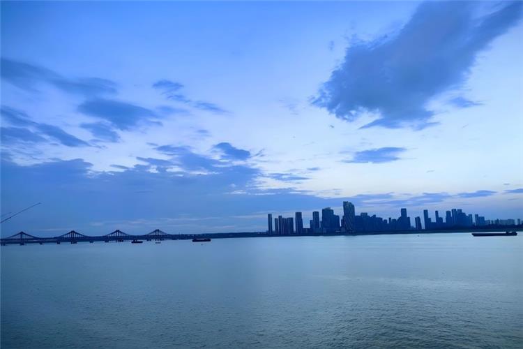 Qiantang River in Hangzhou showing massive surging silver tidal wave rushing forward