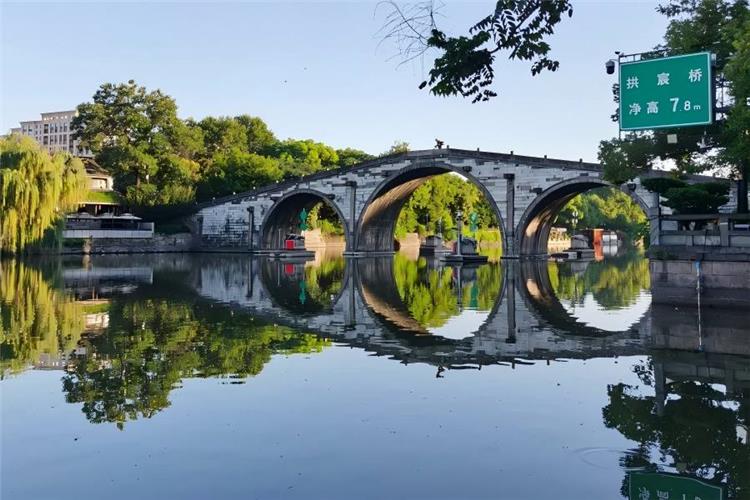 Gongchen Bridge over Grand Canal Gongchen Bridge in Hangzhou presenting grand ancient stone bridge with canal water flowing underneath