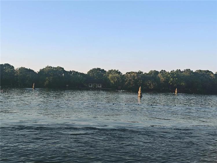 West Lake in Hangzhou featuring UNESCO World Cultural Landscape with integrated mountains, water, ancient architecture and profound Jiangnan culture