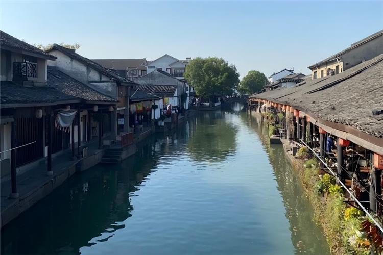 World-famous cultural water town Wuzhen, permanent venue of World Internet Conference and Wuzhen Theatre Festival, blending ancient canal charm with modern literary and internet culture