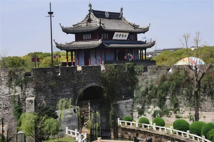 Pan Gate in Suzhou showing China’s only intact ancient dual land-and-water city gate with ancient city wall, canal and pagoda scenery