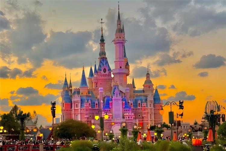 Shanghai Disneyland in Shanghai featuring Enchanted Storybook Castle, fairy-tale theme park scenery and colorful amusement facilities