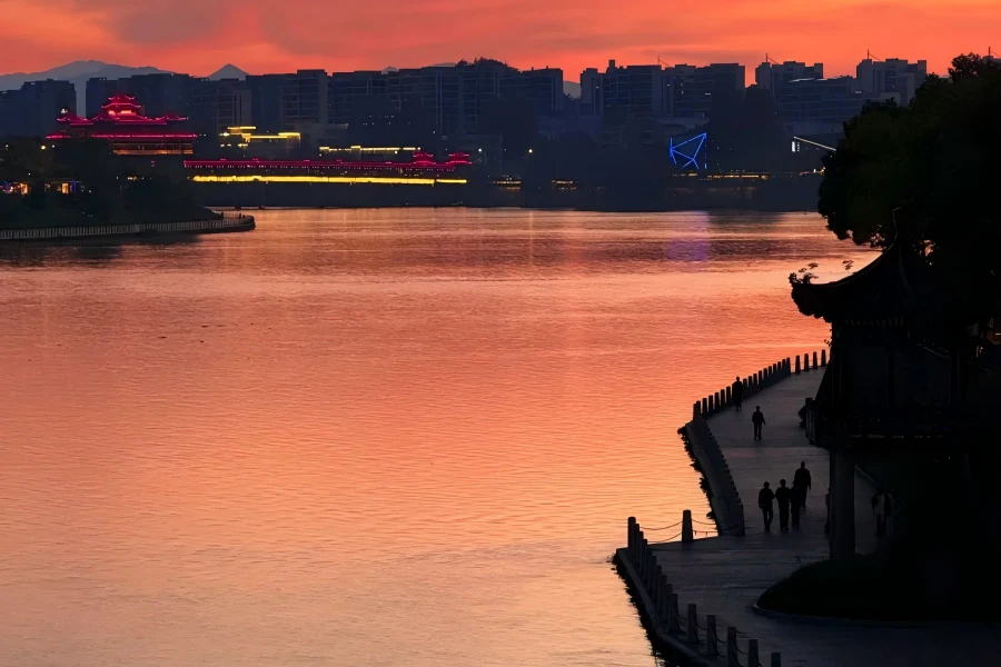 Tunxi Old Street in Huangshan showing well-preserved Song-Ming-Qing Huizhou-style ancient pedestrian street lined with horse-head wall buildings, red lanterns, time-honored ink and tea shops, hailed as a living Riverside Scene at Qingming Festival along Xin’an River
