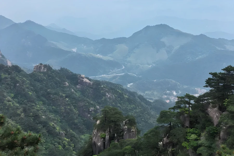 Mount Jiuhua in Anhui showing one of China’s Four Sacred Buddhist Mountains, the sacred dojo of Ksitigarbha Bodhisattva, dotted with ancient Zen temples, sea of clouds, green pine peaks and well-preserved mummified monk Buddha shrines