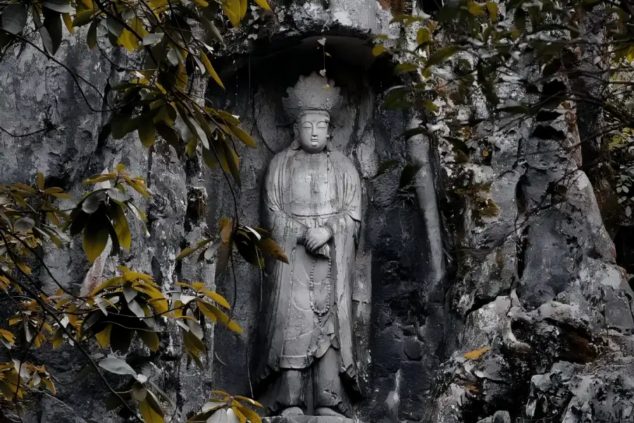 Feilai Peak Buddha Rock Carvings Limestone Feilai Peak dotted with Song-Yuan Buddhist grotto statues, clear brooks and twisted old pines in West Lake scenic area.