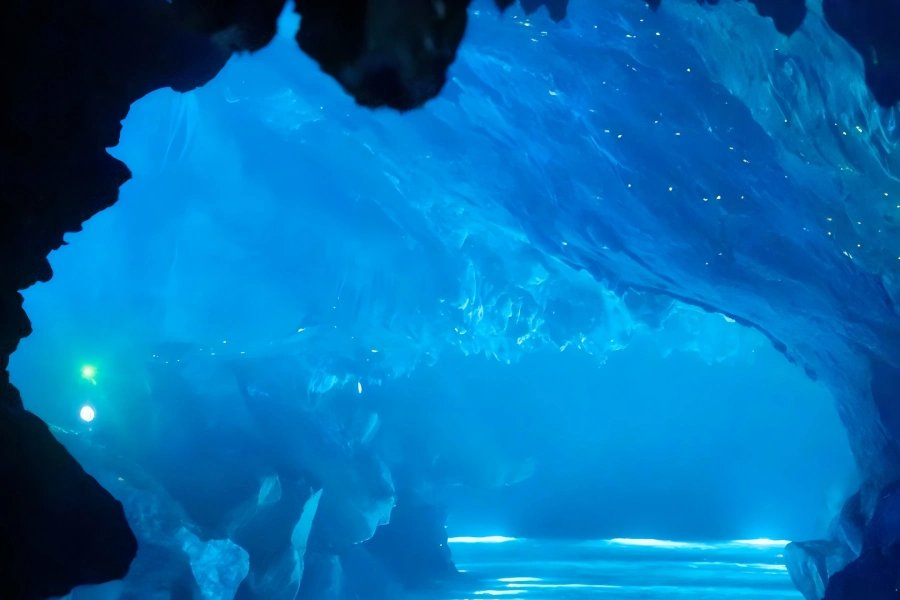 OMG Heartbeat Park in Tonglu Hangzhou showing dreamy blue-lit underground karst cave and quiet subterranean waterway