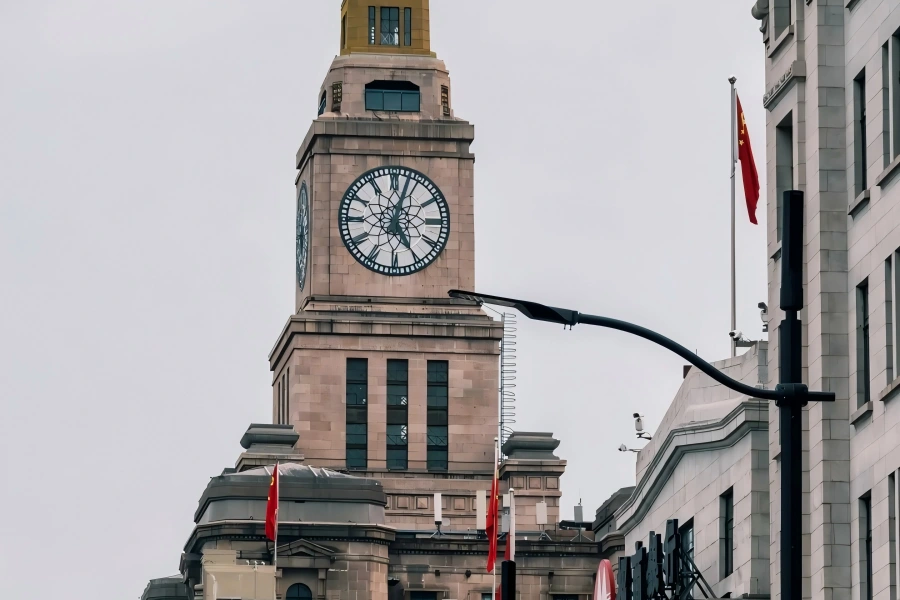 Custom House Clock in Shanghai showcasing the iconic giant clock tower standing along the Bund beside Huangpu River