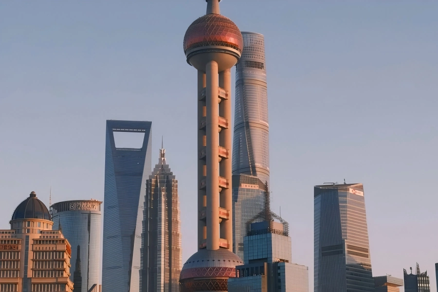 Oriental Pearl Tower in Shanghai featuring distinctive spherical towers standing by Huangpu River amid Lujiazui skyscrapers