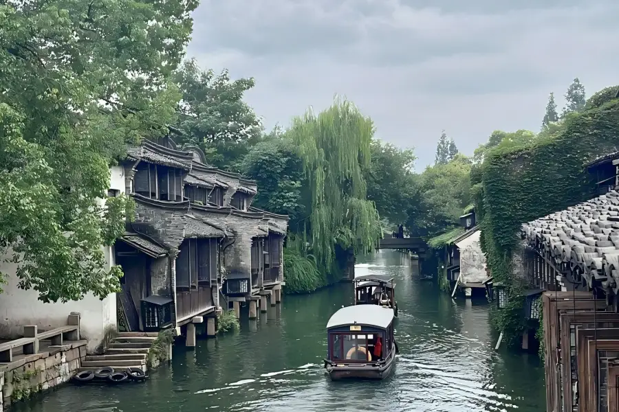 Original Wuzhen East Water Town Wuzhen East Gate in Jiaxing showing original Jiangnan water town canals, wooden houses and hand-rowed boats