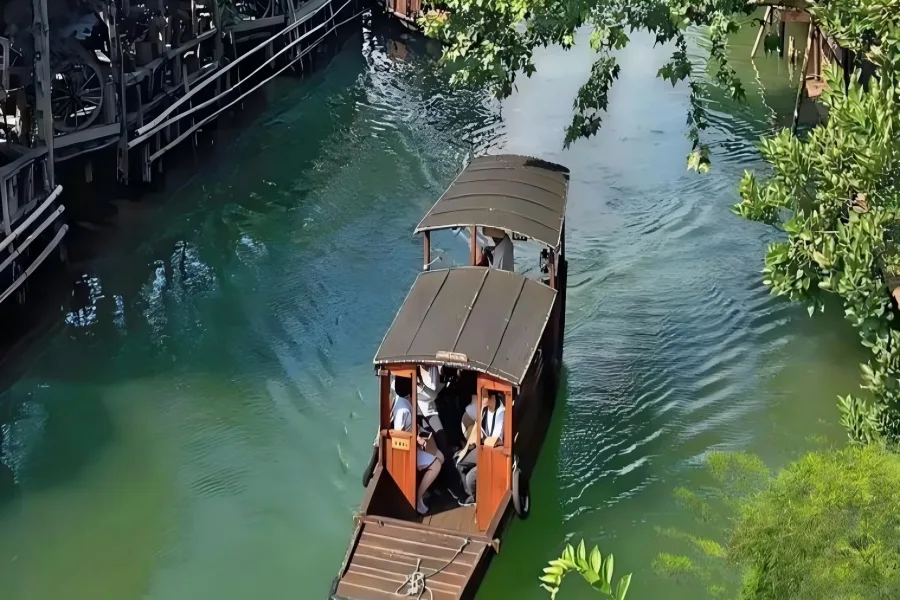 Xitang Ancient Town known as hometown of traditional Chinese fabric frog fasteners, showcasing tranquil river views, ancient private manors and slow drifting black-awning wooden boats