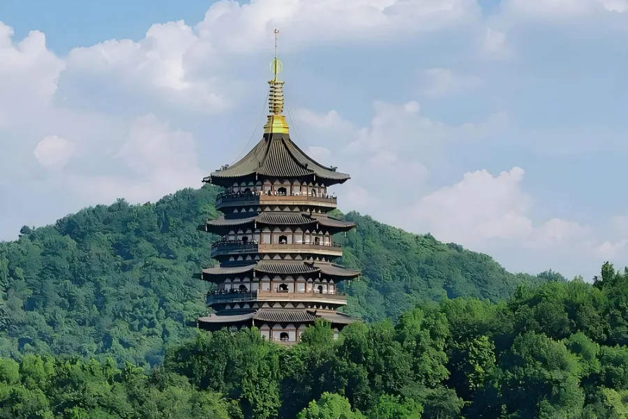 Leifeng Pagoda in Hangzhou showing ancient pagoda overlooking West Lake with lake and mountain scenery