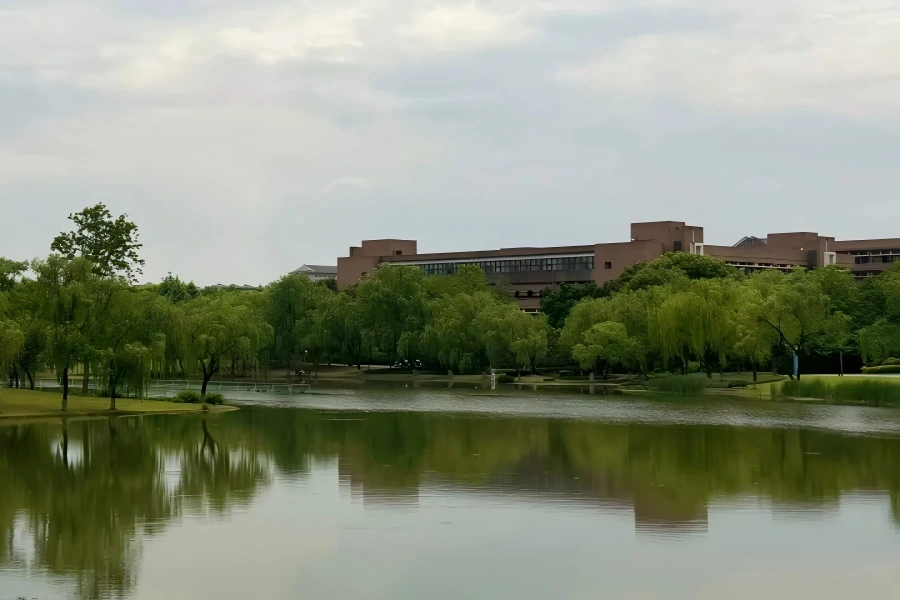 Serene lake and lush trees in Zhejiang University campus