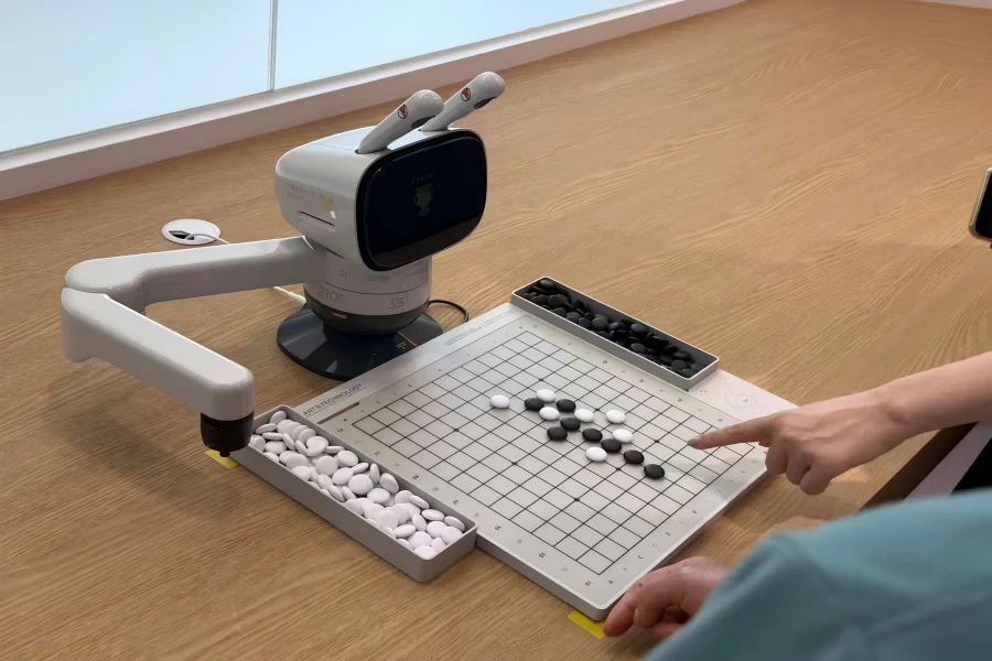 Robotic arm plays go chess with visitors at AI exhibition