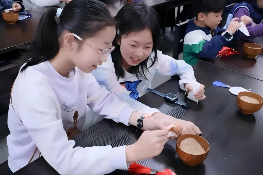 Children handcrafting traditional herbal sachets