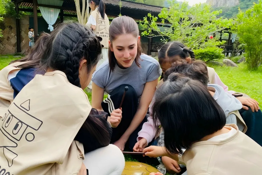 Students joining immersive interactive art activity outdoors