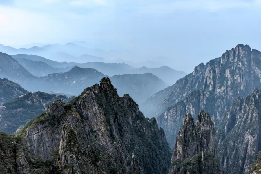 Famous mountain featuring strange pines, grotesque rocks, sea of clouds and hot springs