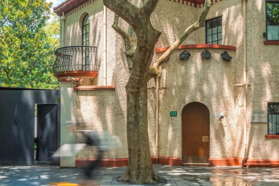 Historic street lined with plane trees, vintage villas and iconic Wukang Mansion in former French Concession Shanghai