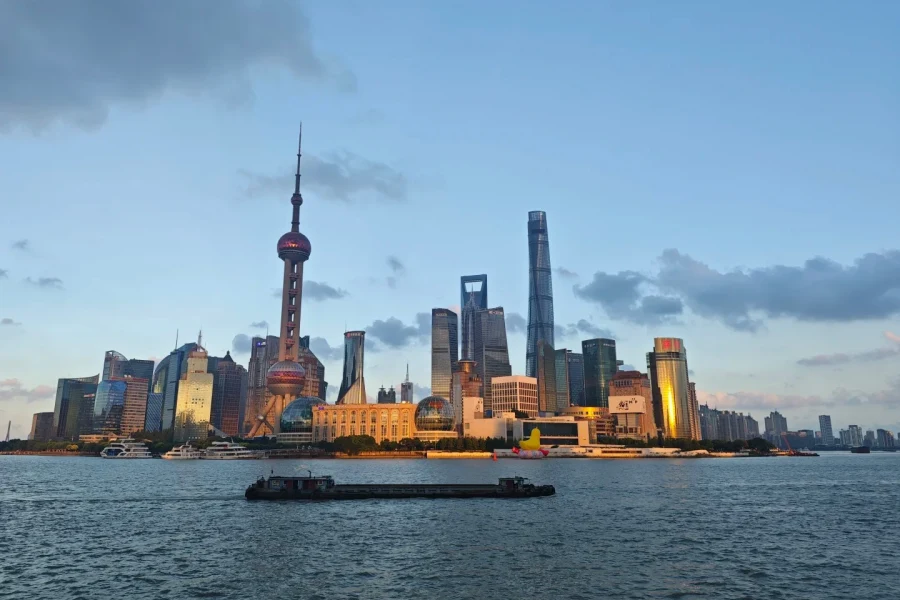 Iconic waterfront promenade along Huangpu River, featuring century-old exotic buildings and panoramic view of Pudong skyline