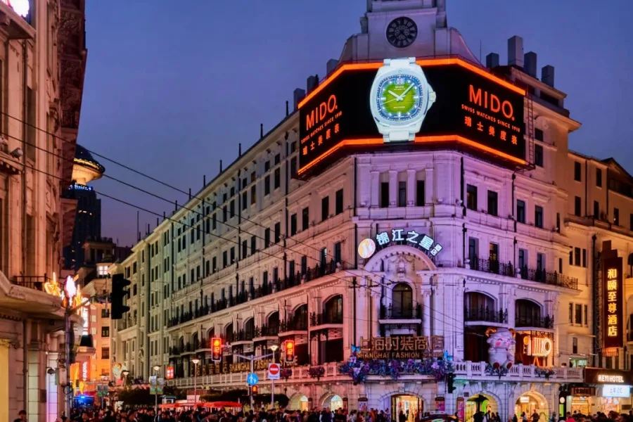 Nanjing Road Pedestrian Street in Shanghai, bustling commercial avenue with modern shopping malls and classic historic buildings
