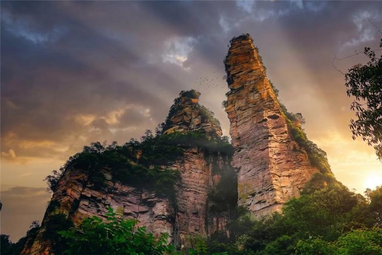 Zhangjiajie Towering Sandstone Peaks Sunset Epic sunset light hitting sharp karst mountain pillars in Zhangjiajie