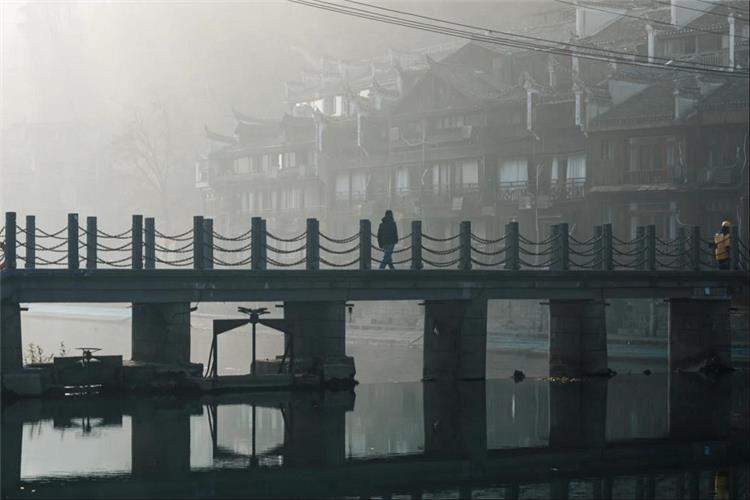 Misty Dawn Footbridge Fenghuang Ancient Town Foggy morning scene with pedestrian bridge at Fenghuang Ancient Town, Hunan