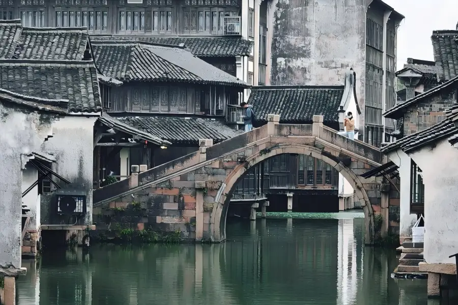 Wuzhen Water Town in Zhejiang showing classic Jiangnan canal scenery, ancient stone?arch bridges and waterside grey?tile dwellings