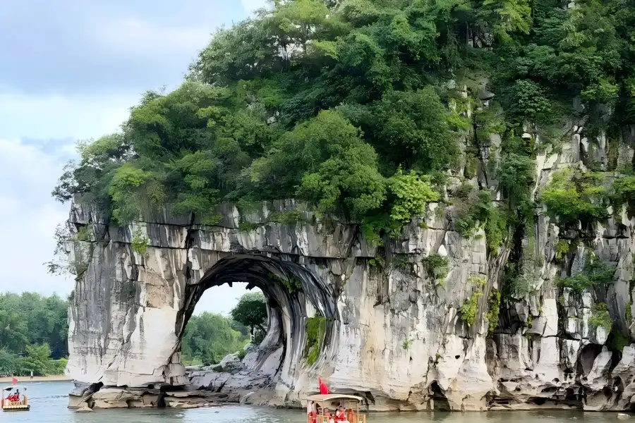 Elephant Trunk Hill Scenic Area in Guangxi presenting Guilin’s city symbol, unique limestone rock formation standing gracefully along the riverside waterfront