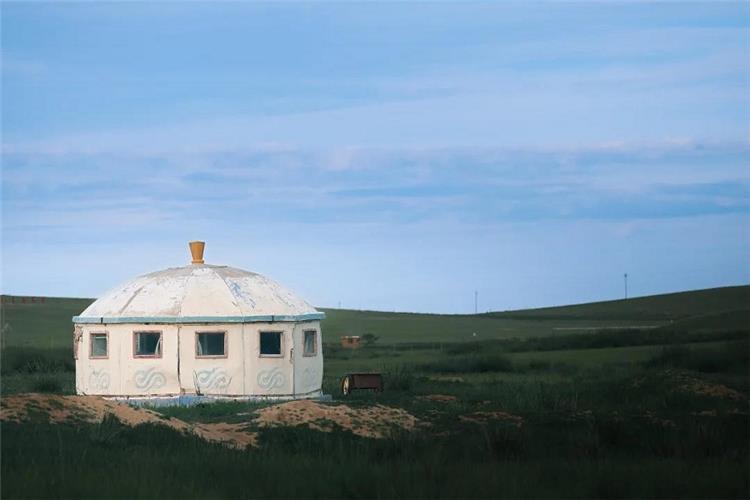 Classic Mongolian ger yurt on Xilamuren grassland plain at dusk, Inner Mongolia