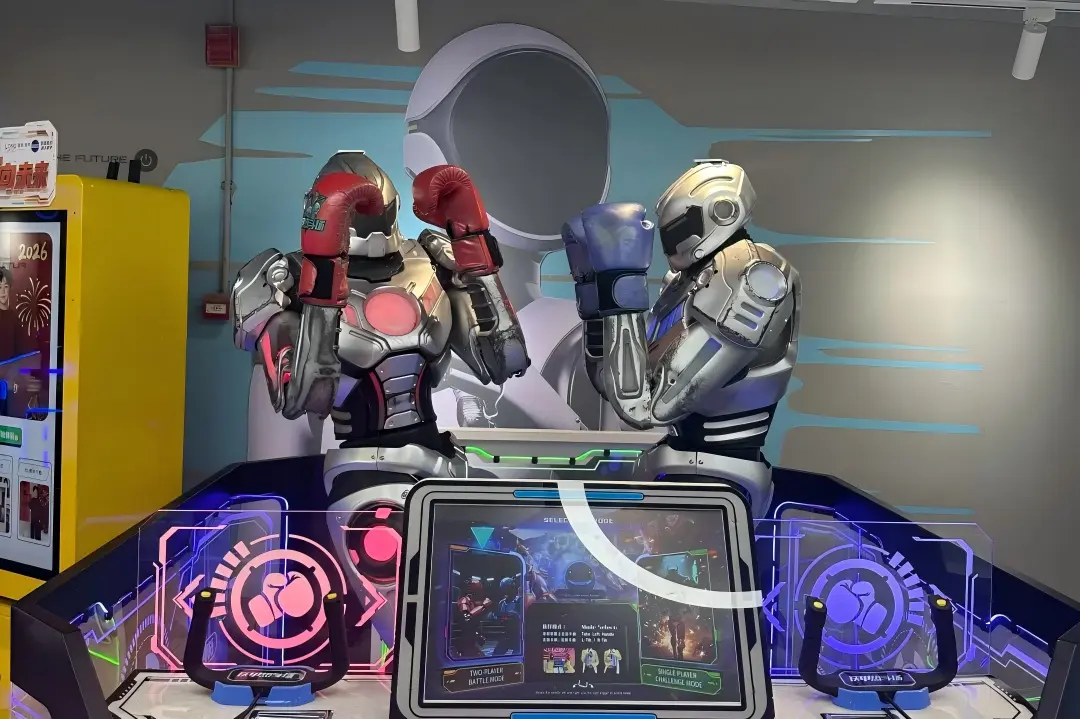 Two fighting boxing robots interactive game exhibit