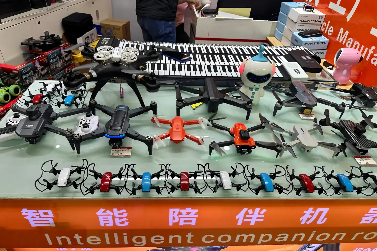 Various consumer drones and intelligent robots displayed at Huaqiang North market