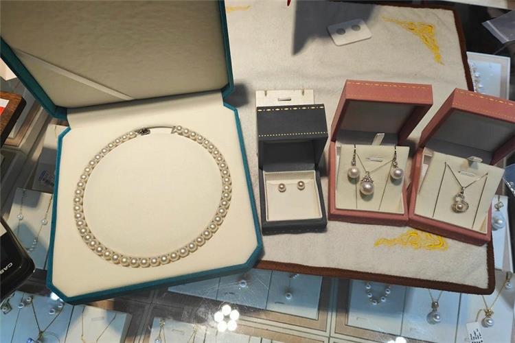 Collection of pearl necklace, earrings and pendants in gift boxes, pearl jewellery retail showcase in Beijing market
